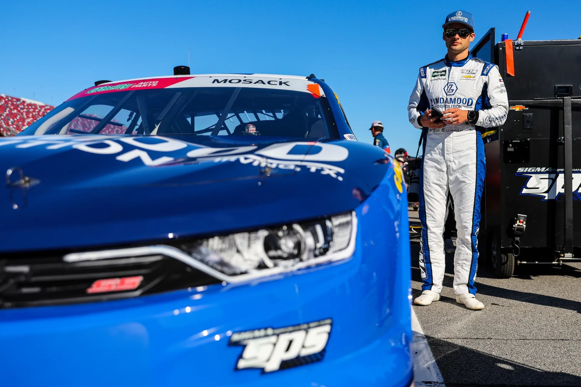 Connor Mosack stands beside the No. 43 Lindamood Chevrolet at Talladega Superspeedway.