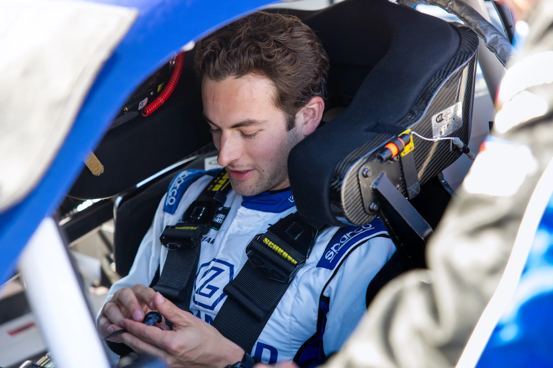Connor Mosack seated in the No. 43 Chevrolet cockpit at Talladega Superspeedway.